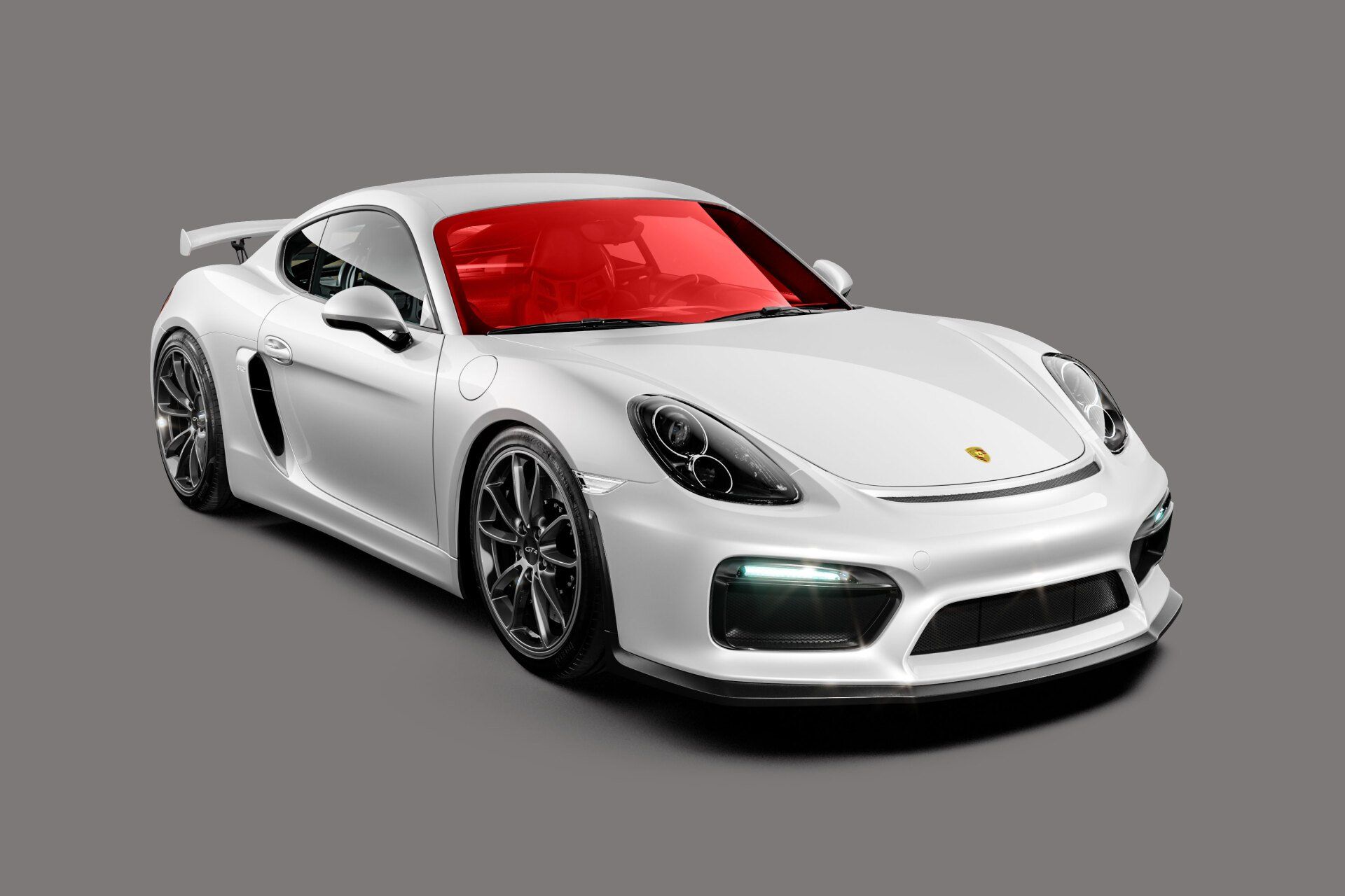 White Porsche sports car with a red windshield on a gray background.