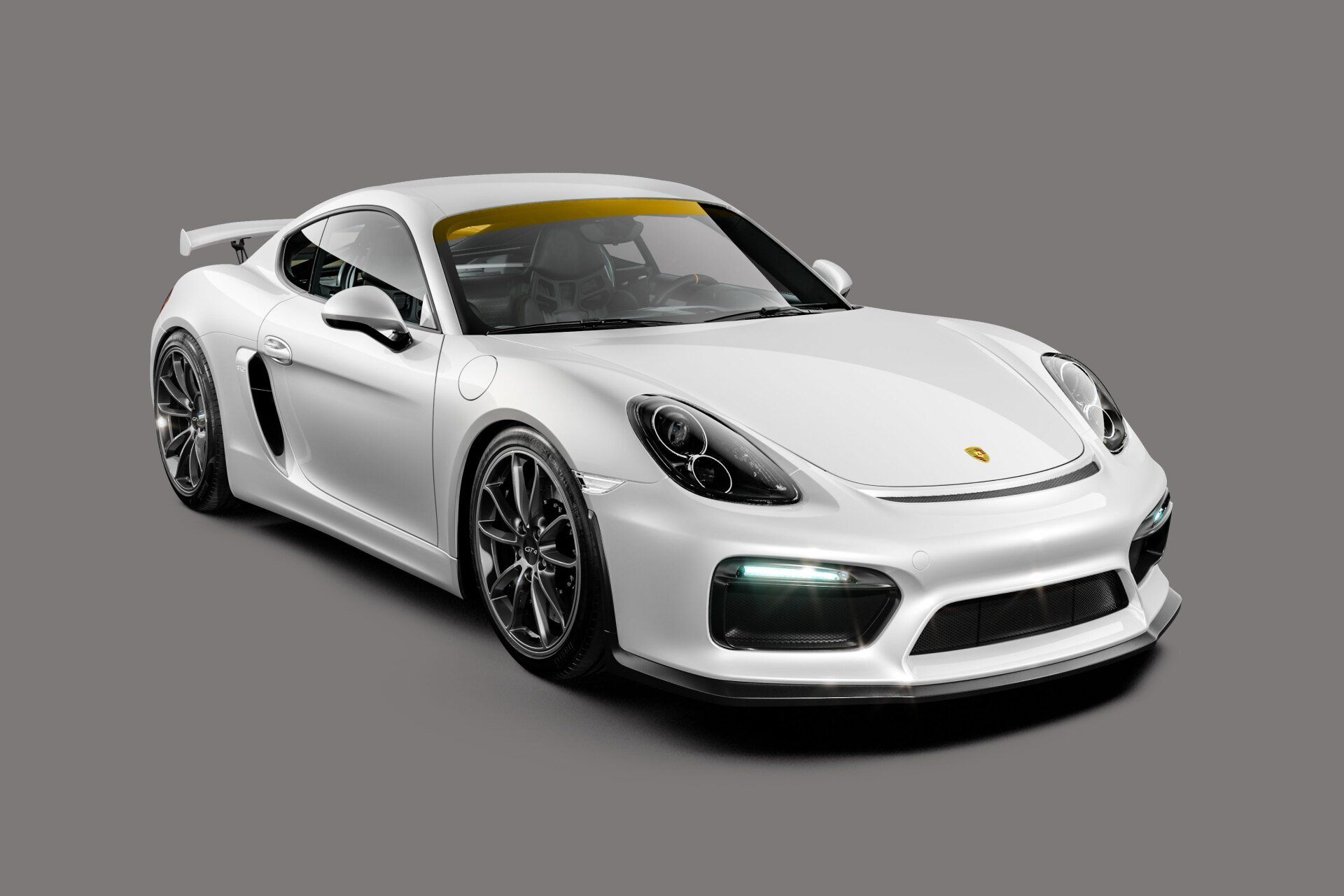 White Porsche sports car with black wheels, on a gray background.