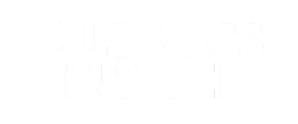 Mostly blank white image with faint vertical gray marks across the center.
