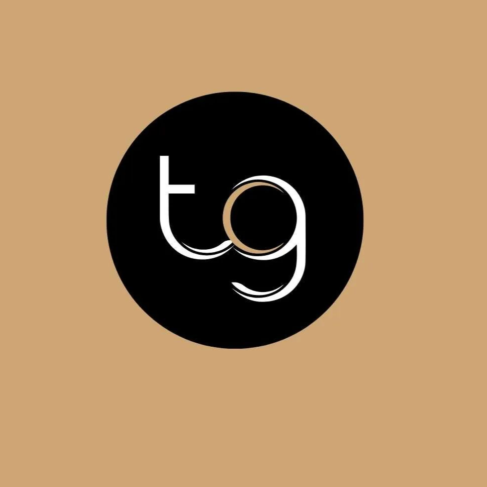 Black circle logo with lowercase white “tg” on a tan background