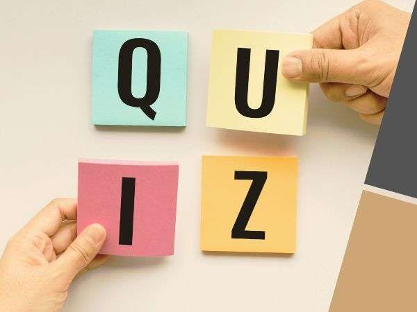 Hands arranging colorful letter tiles spelling “QUIZ” on a light background