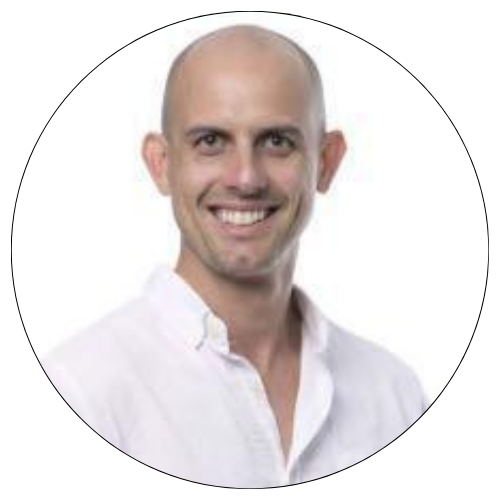 Smiling bald man in a white shirt on a white background