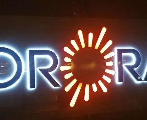 A neon sign that says or on it