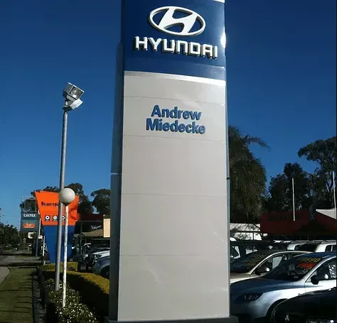 A blue and white sign for hyundai andrew miedecke