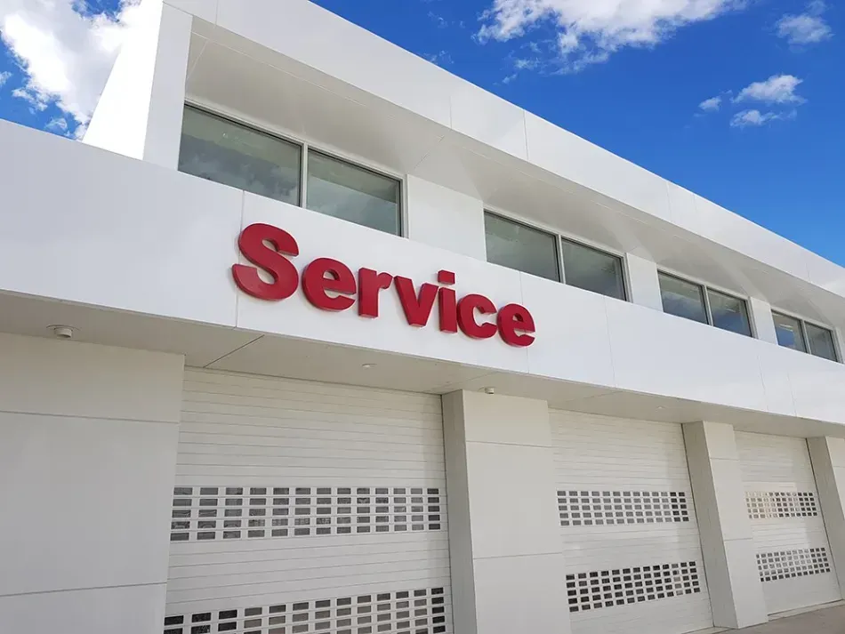 A white building with the word service on it