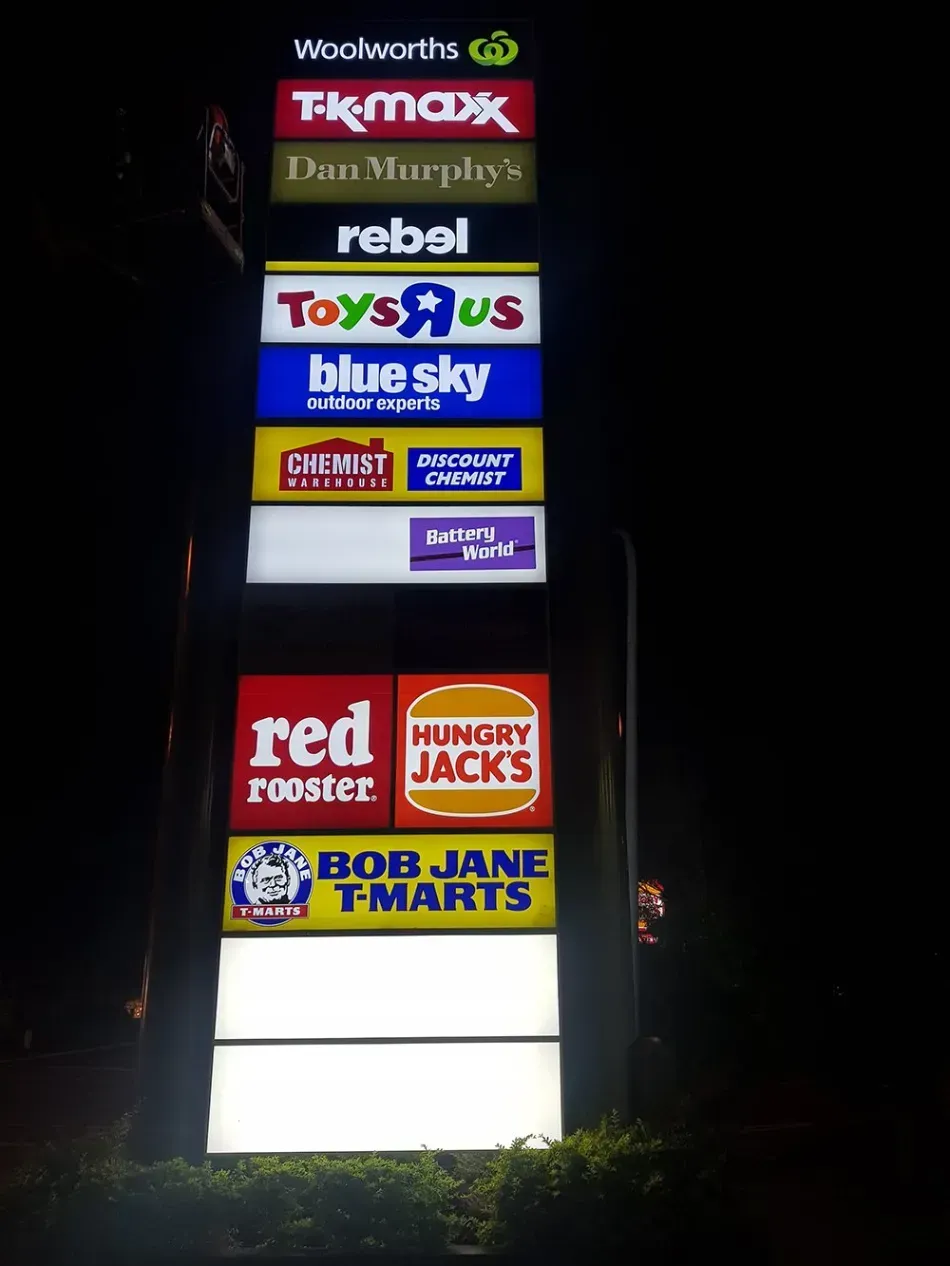 A sign for toys r us blue sky red hungry jacks and bob jane t-marts