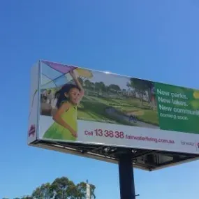 A billboard with a picture of a little girl on it