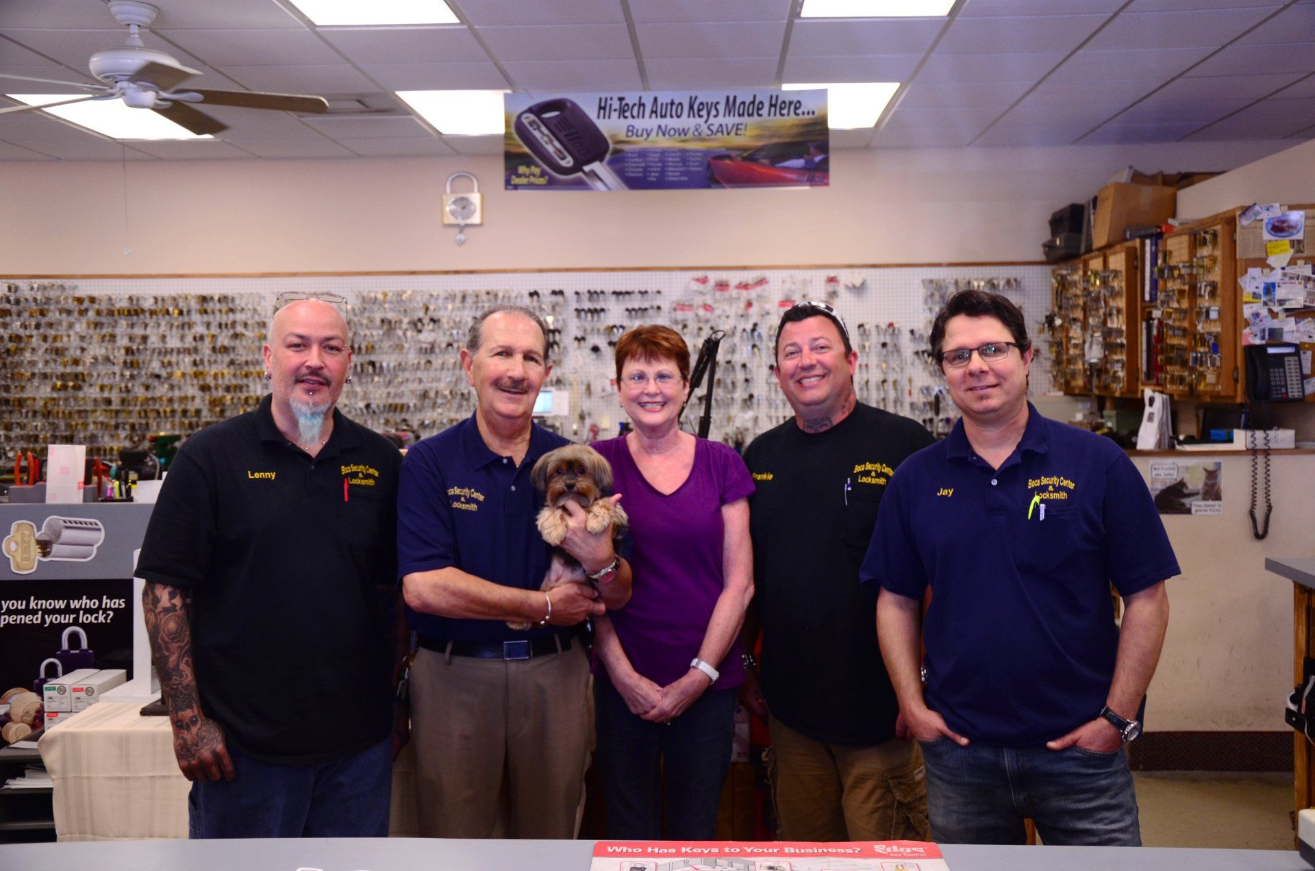 A group of people are posing for a picture in a store.
