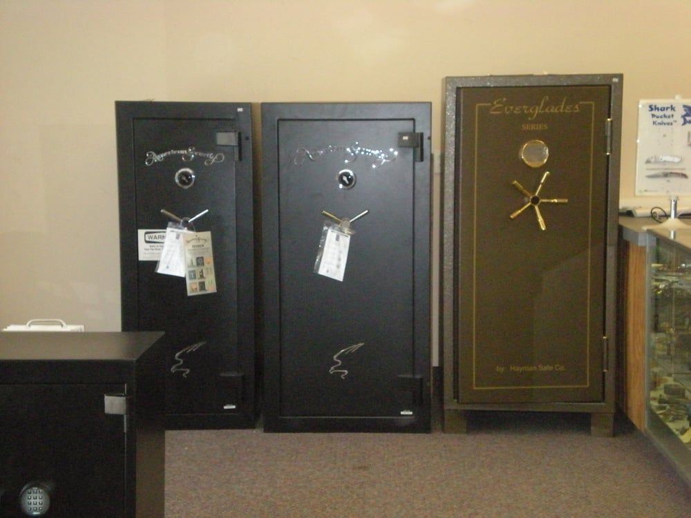 Three safes are lined up in a room and one of them has a tag on it