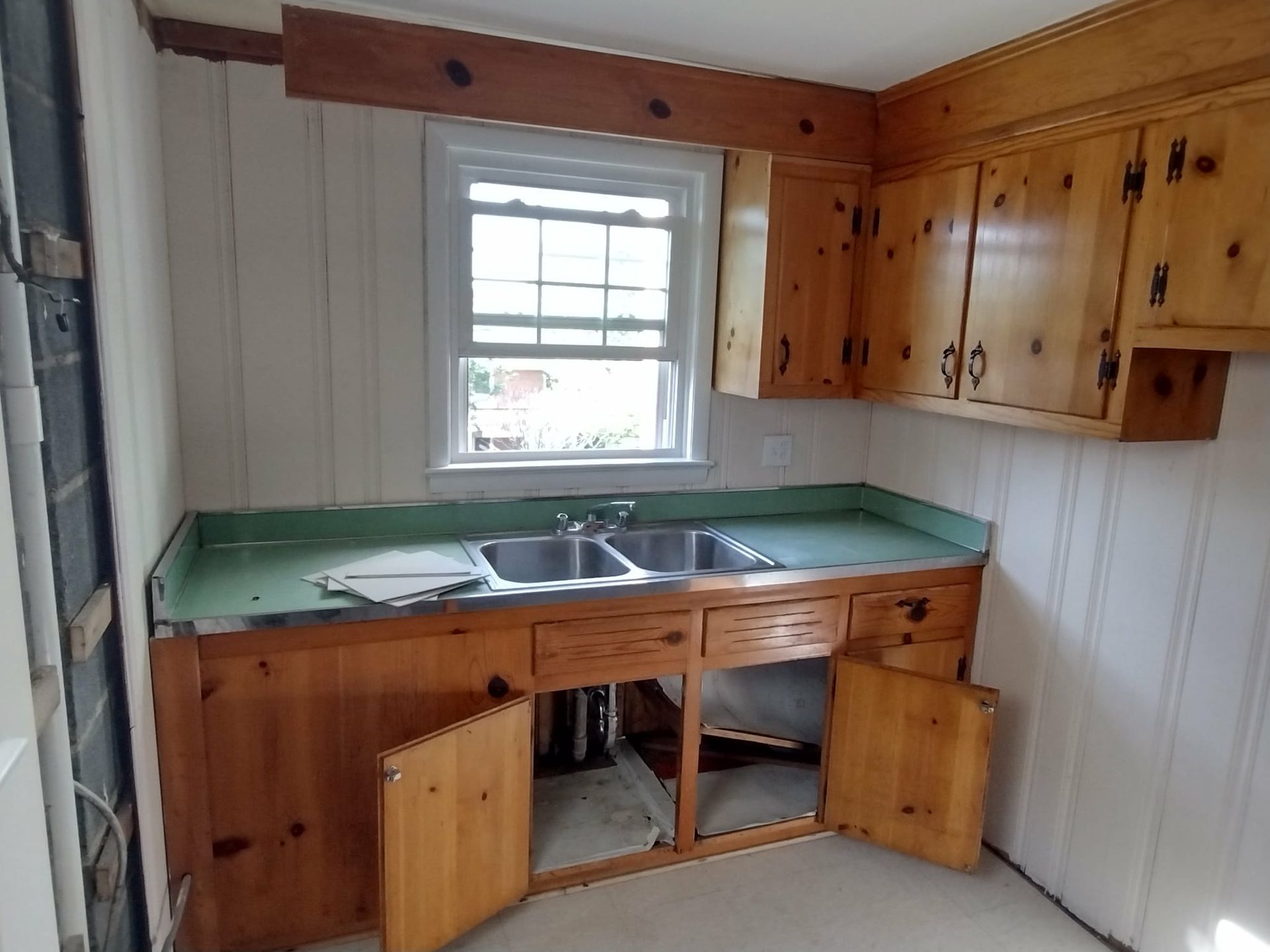 After image of kitchen remodel. You can tell that they installed new kitchen cabinets. 