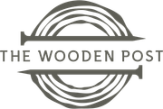 The Wooden Post logo with gray circular wood-grain rings and text across the center