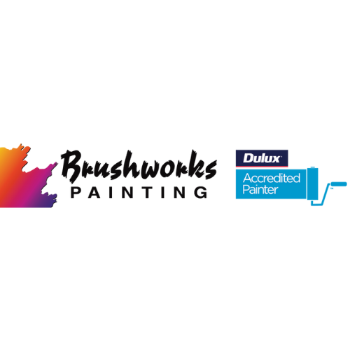 A Man is Painting a Wall With a Roller Next to a Ladder — Brushworks Painting In Thurgoona, NSW.