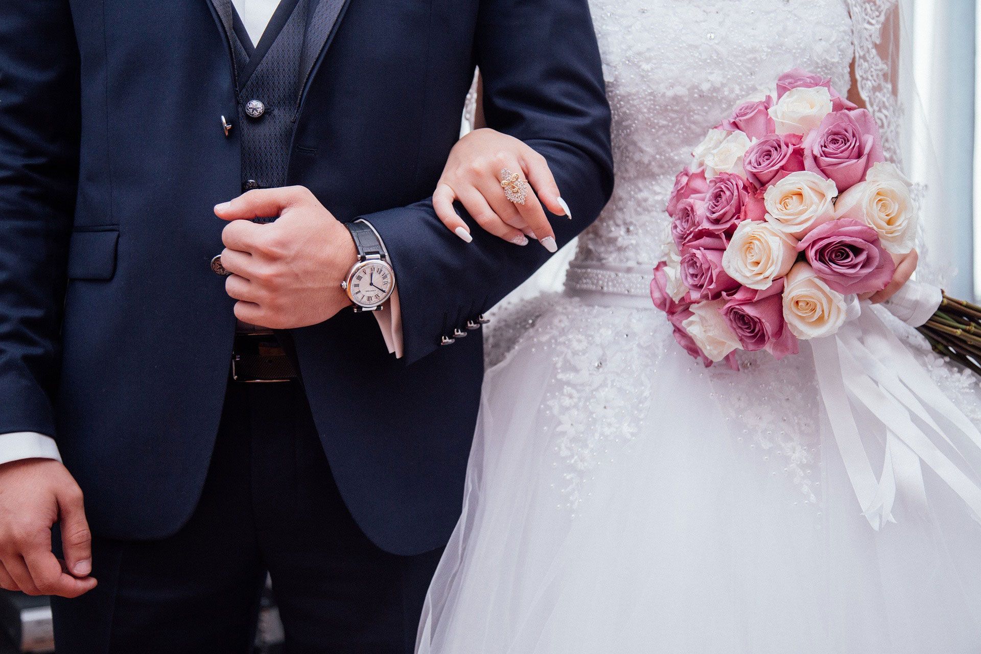 Wedding couple holding hands