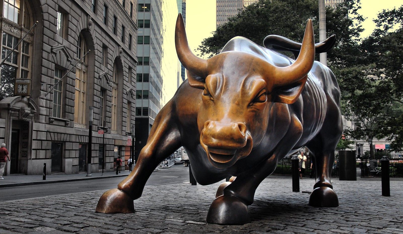 A statue of a bull in front of a building