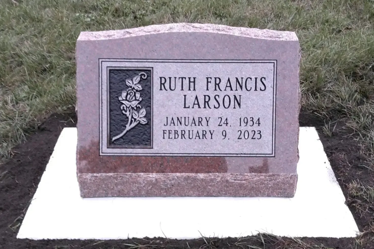 Ruth Francis Larson gravestone with pink stone and engraved plaque, dated January 24, 1934–February 9, 2023