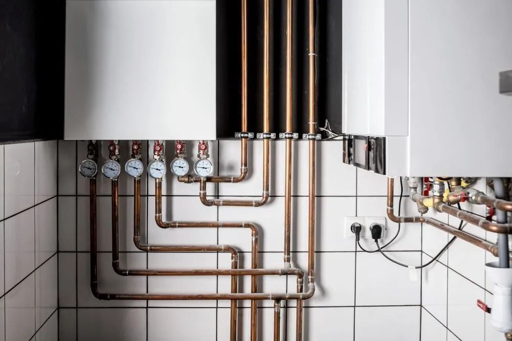 Copper Pipes and Gauges on Tiled Wall — Climate King In Orange, NSW