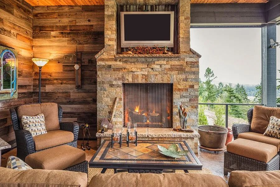 Outdoor Living Space With Fireplace, Tv, and Seating — Climate King In Orange, NSW