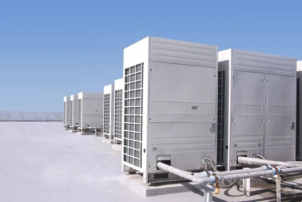 Rooftop View of Several Large, White Hvac Units Against a Blue Sky — Climate King In Cowra, NSW