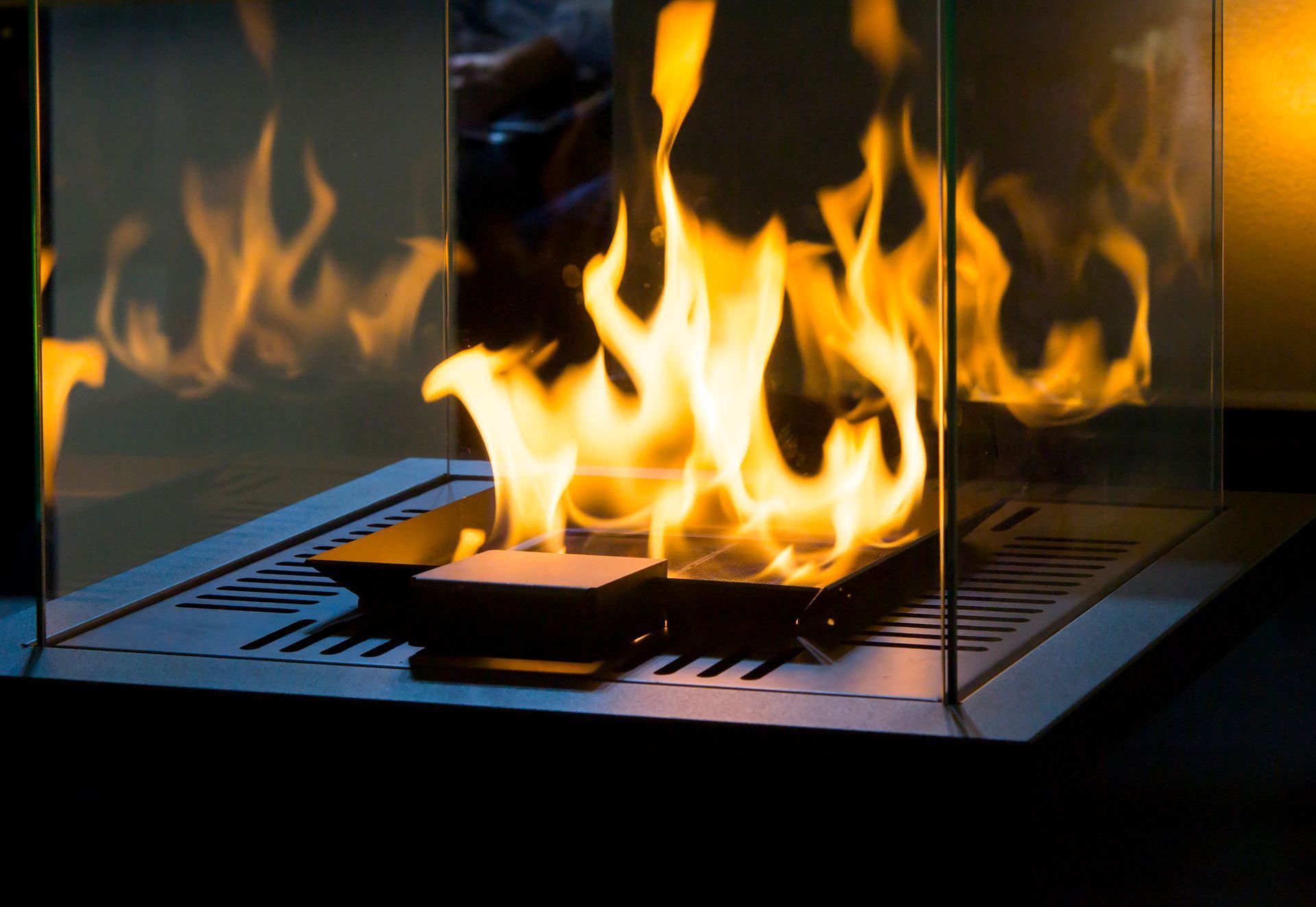 A Modern Fireplace With Flames Burning Within a Glass Enclosure — Climate King In Orange, NSW