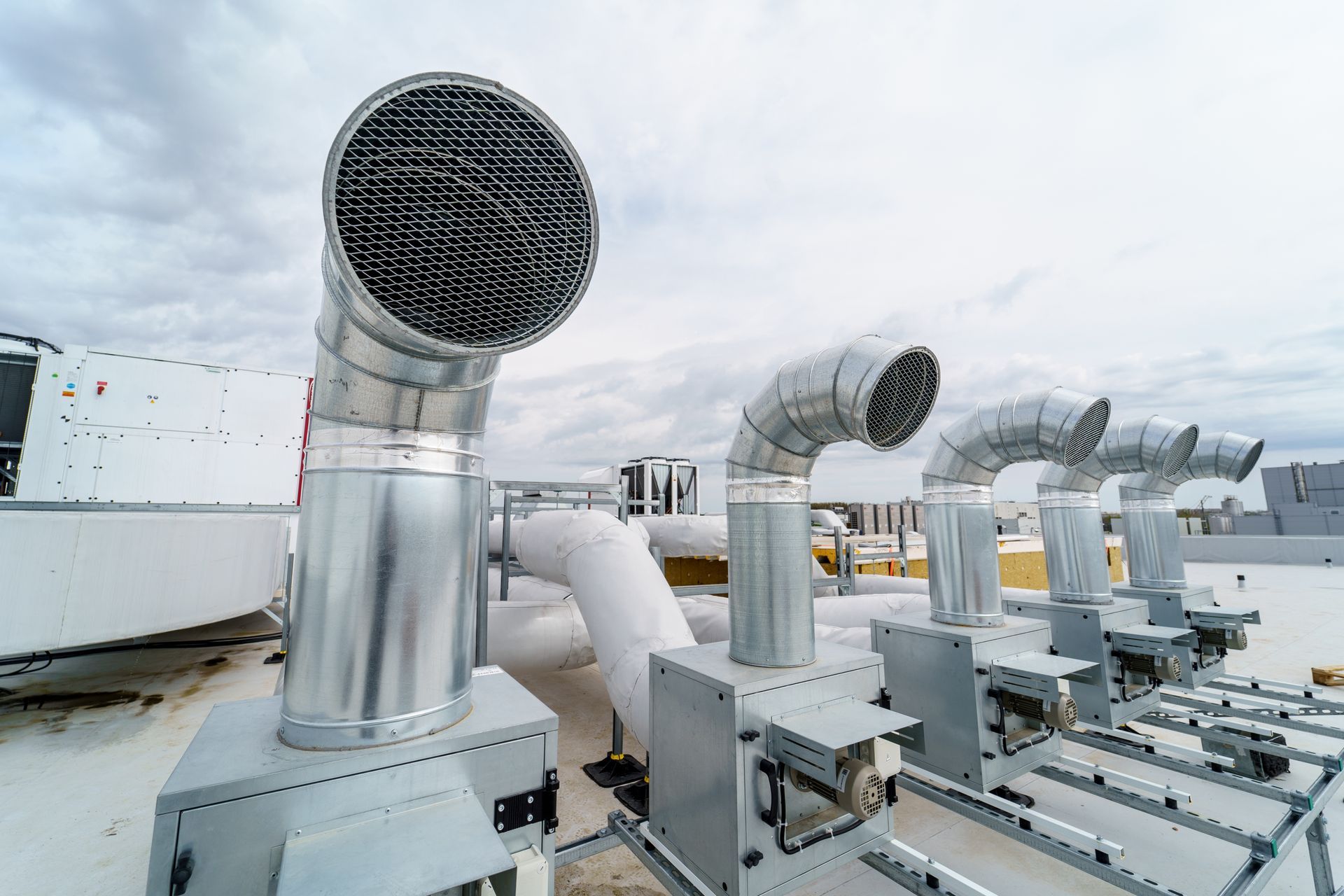Rooftop Ventilation System With Metal Exhaust Pipes — Climate King In Orange, NSW