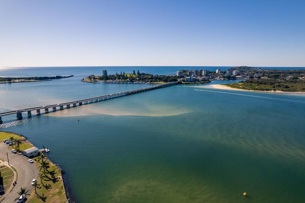 An Aerial View of a Bridge Over a Body of Water — Roofing Contractor in Forster, NSW