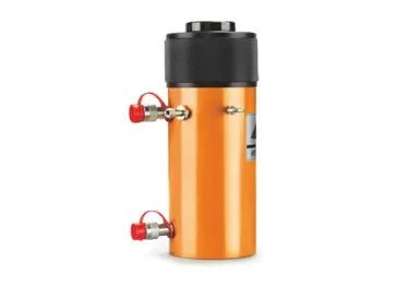 Vérin hydraulique orange avec couvercle noir et raccords rouges.