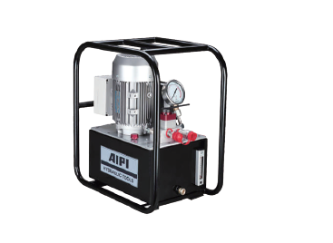 Groupe hydraulique électrique AIPI avec manomètre, logé dans un châssis métallique de protection noir.
