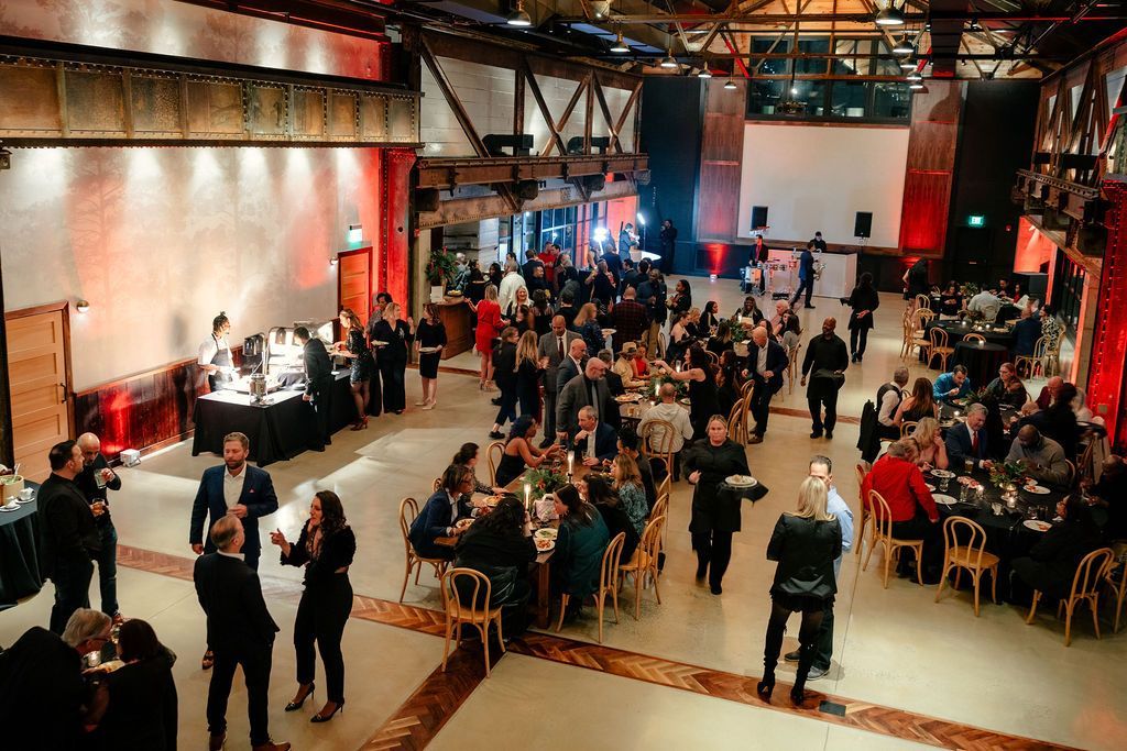 Corporate event in Philadelphia featuring professional DJ entertainment, ambient lighting, and guests.