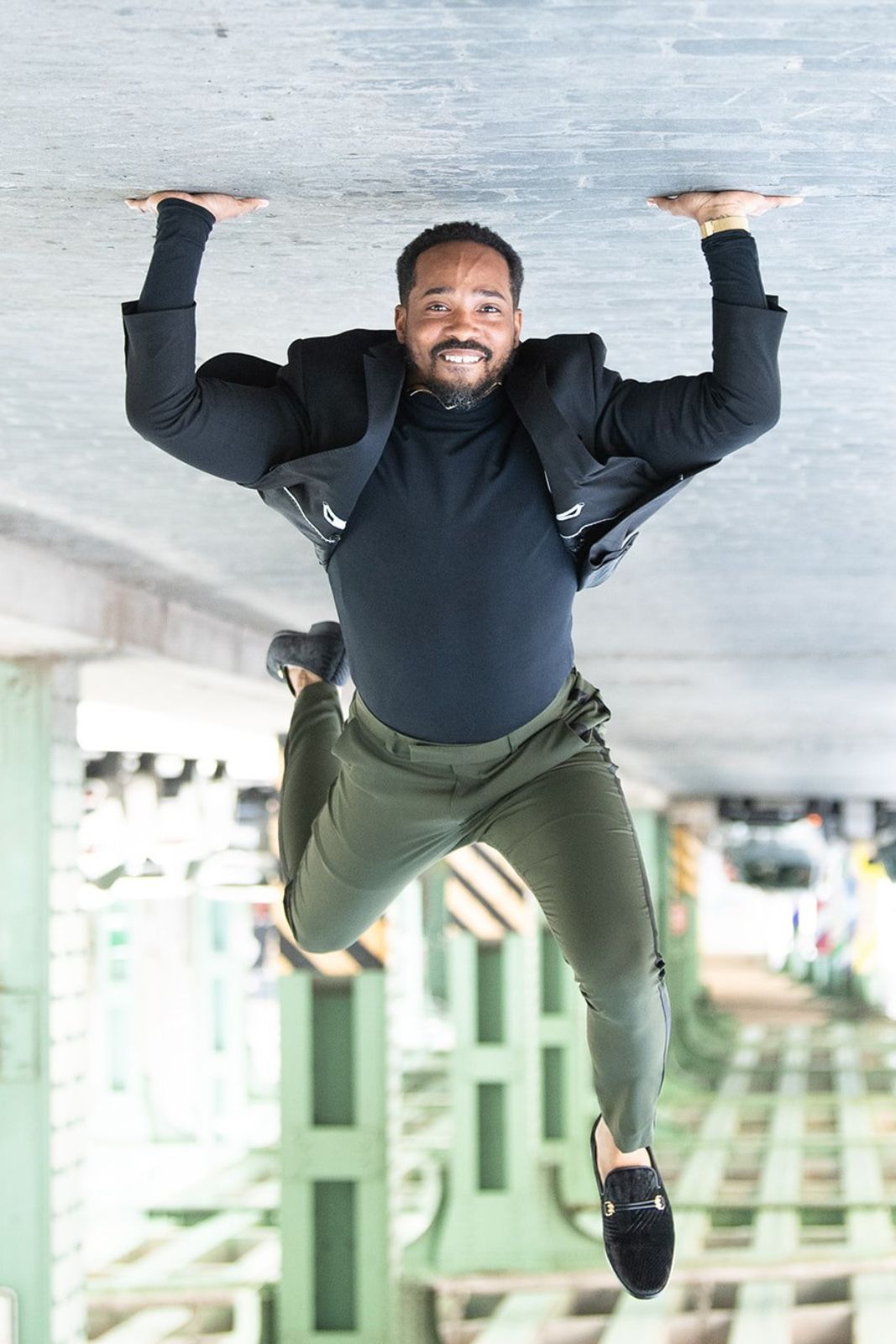 A man is hanging upside down in the air.