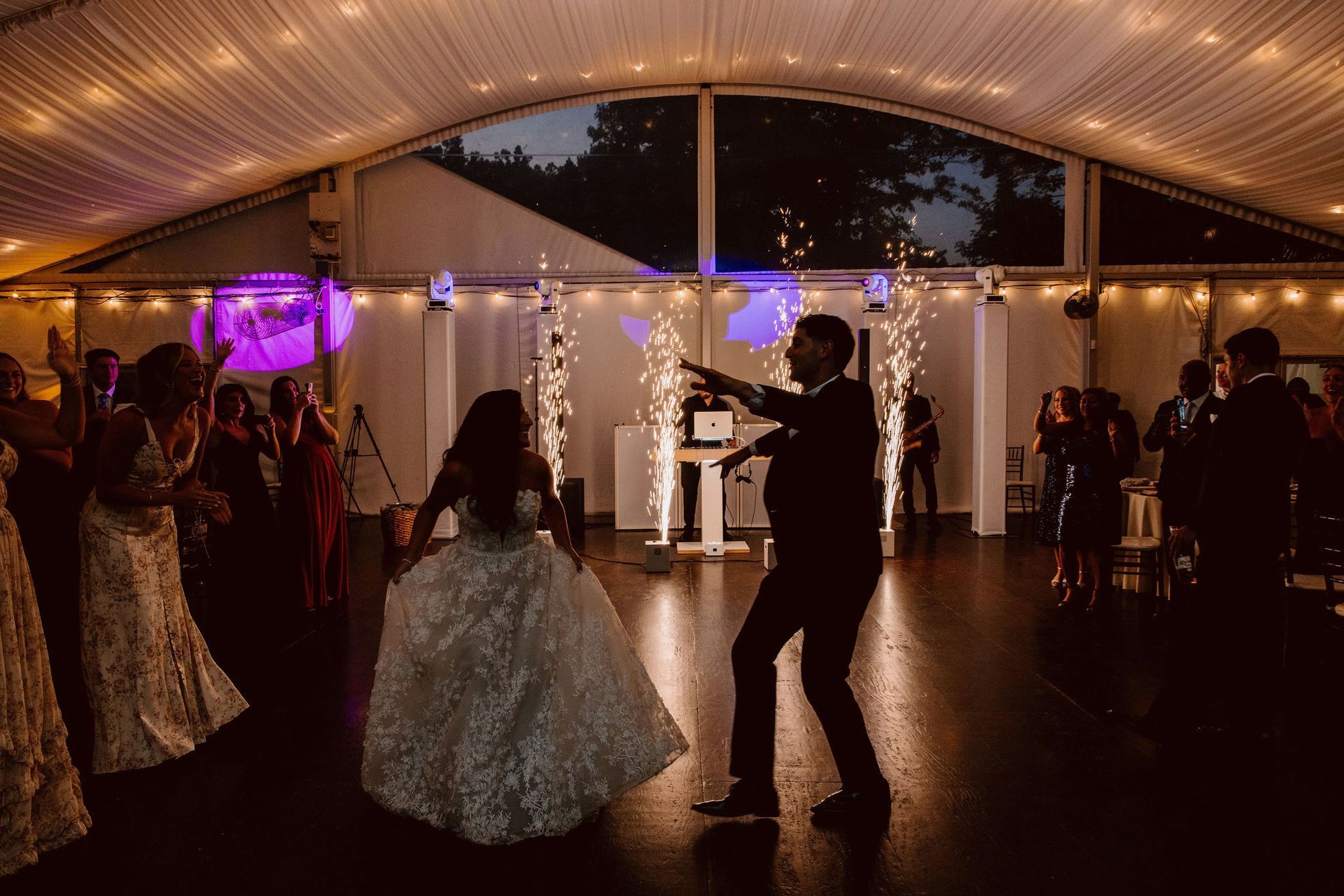 Bride and groom share their first dance at a Philadelphia wedding reception with DJ music.