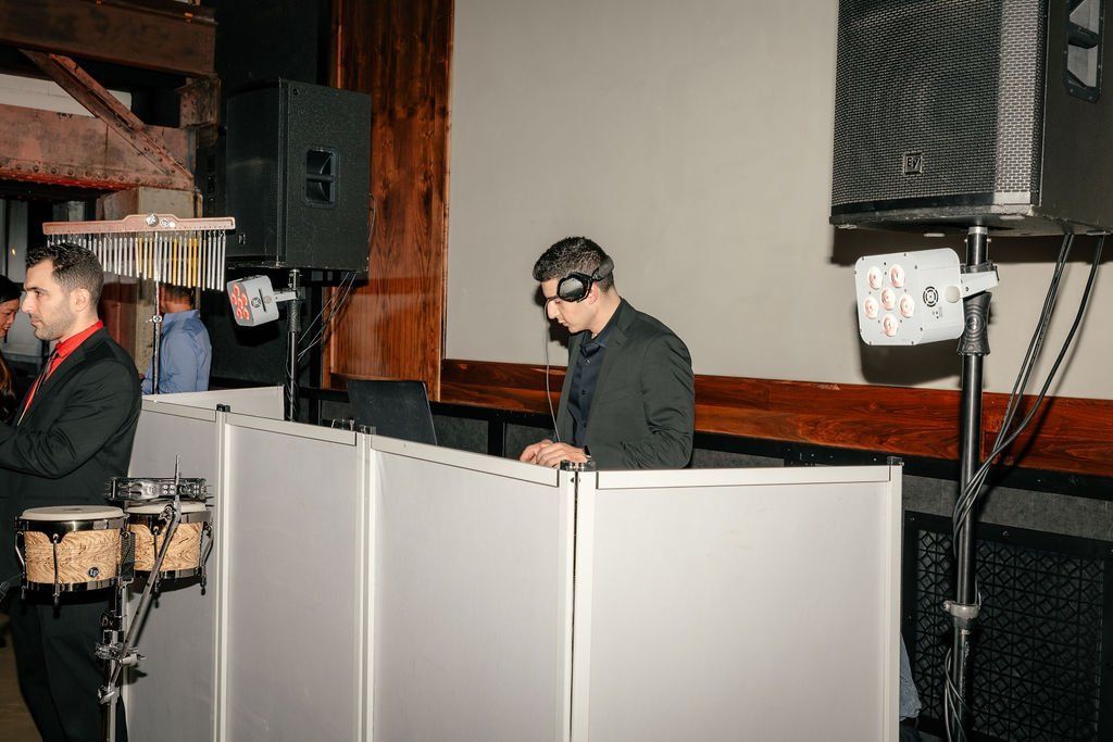 DJ booth and percussion setup at KW Main Line's holiday party at The Pump House.