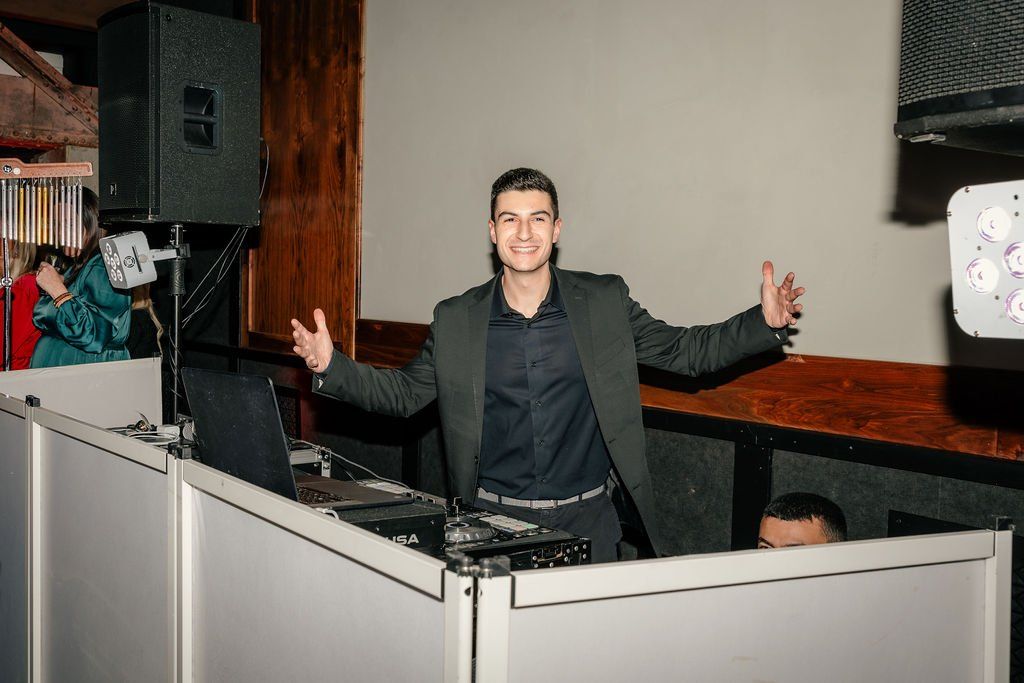 Empower Event Group DJ at the booth during a corporate holiday party.