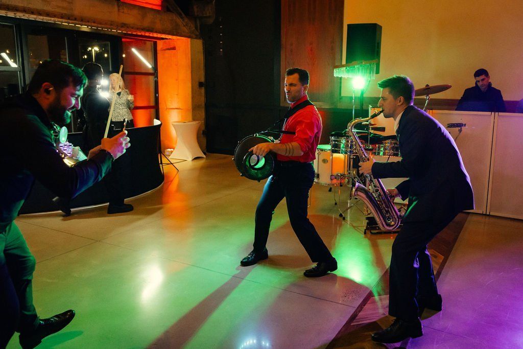 Live saxophonist playing to guests at a corporate party.
