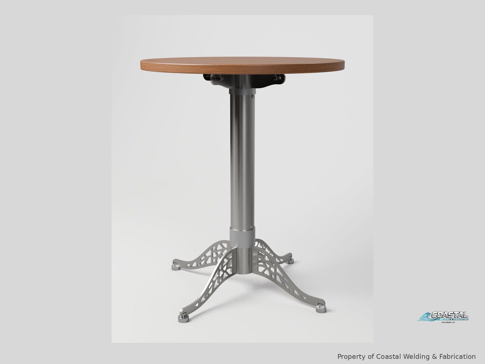Café table with a laser-cut stainless base