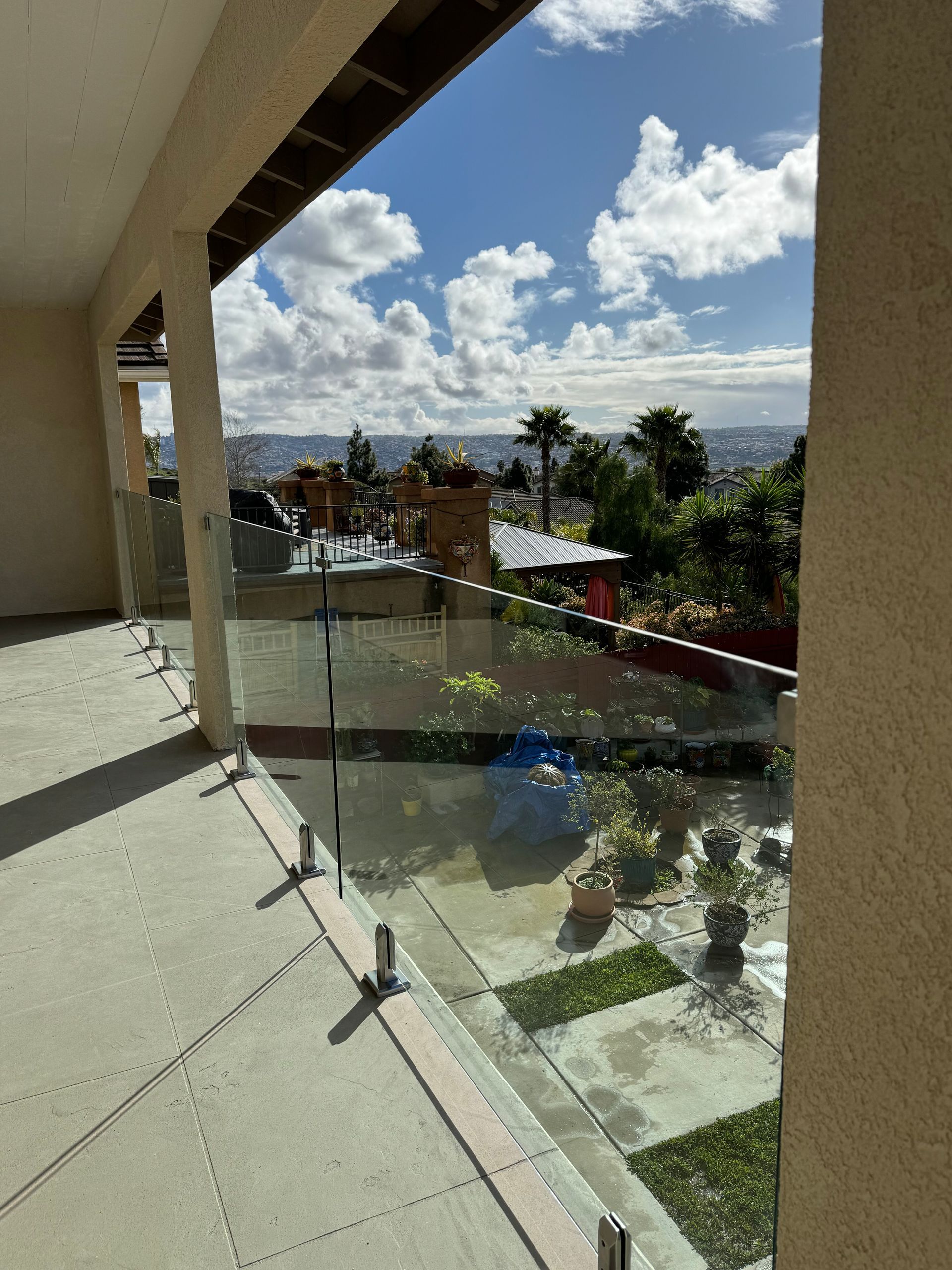 Black steel horizontal railing on an oceanfront rooftop deck