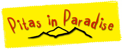 A yellow sign that says ditas in paradise