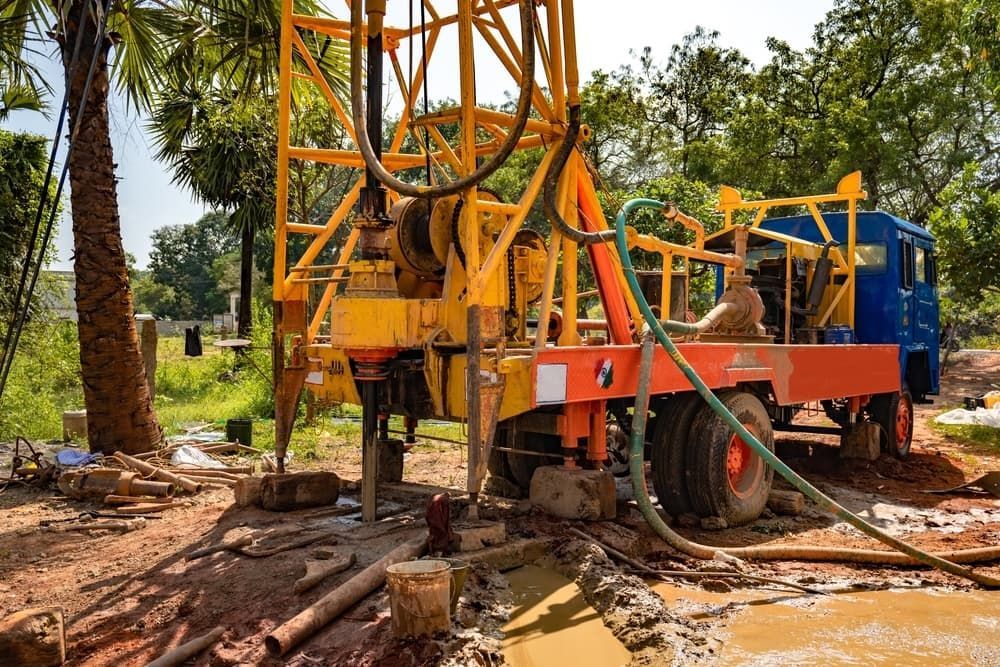 A Truck is Digging a Hole in the Ground — North Coast Drilling & Wicks in Bangalow, NSW