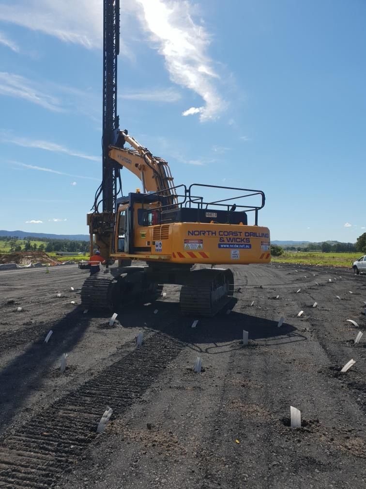 A large digger is on a lot of land  — North Coast Drilling & Wicks in Bangalow, NSW