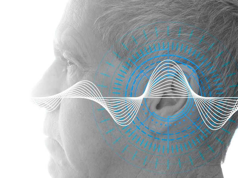 Profile of a face with a blue audio waveform overlaid, suggesting speech or sound analysis