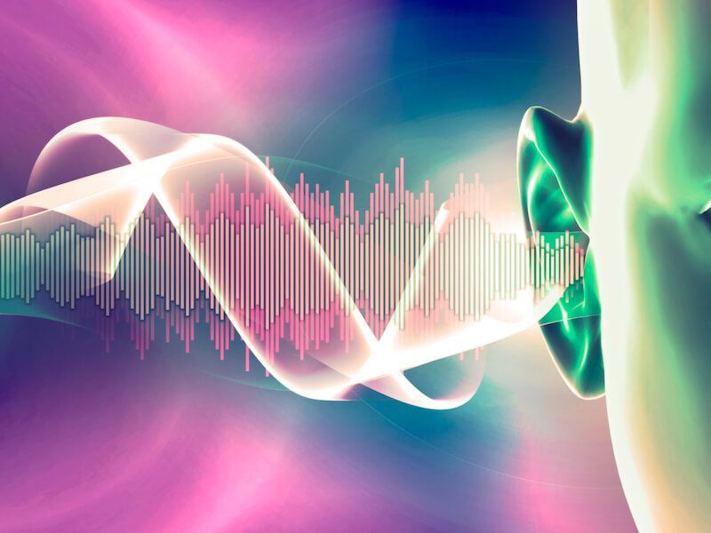 Abstract colorful sound wave visualization with pink, white, and green flowing ribbons over an audio waveform.