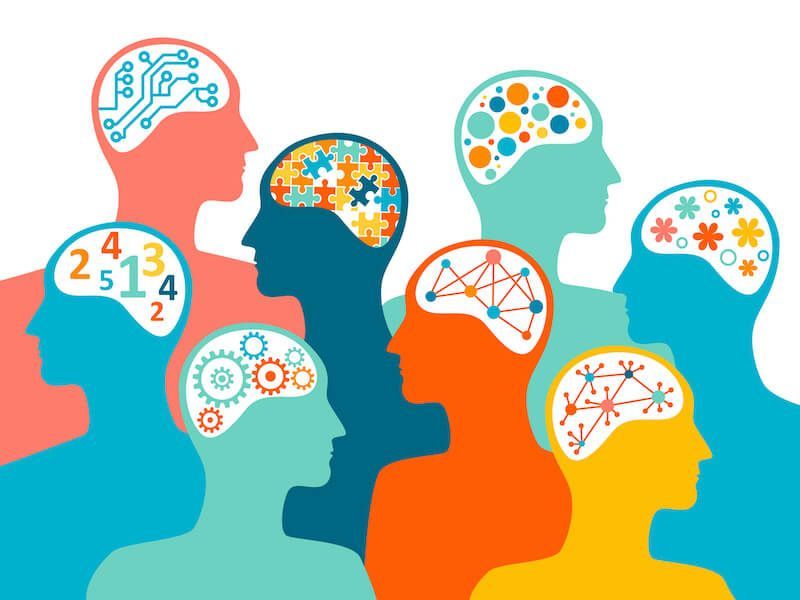 Colorful silhouettes of heads with brains and idea symbols, connected in a creative network.