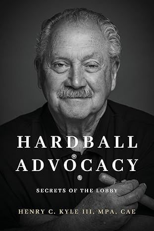 Book cover: smiling man with mustache, title 