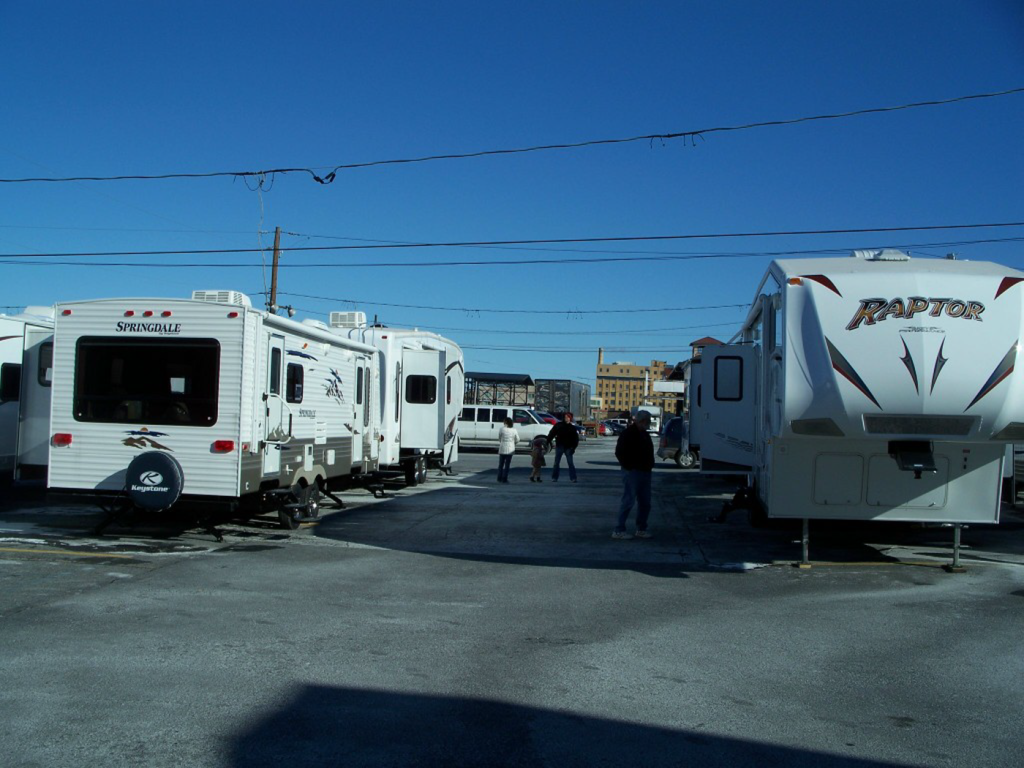 A raptor trailer is parked in a parking lot