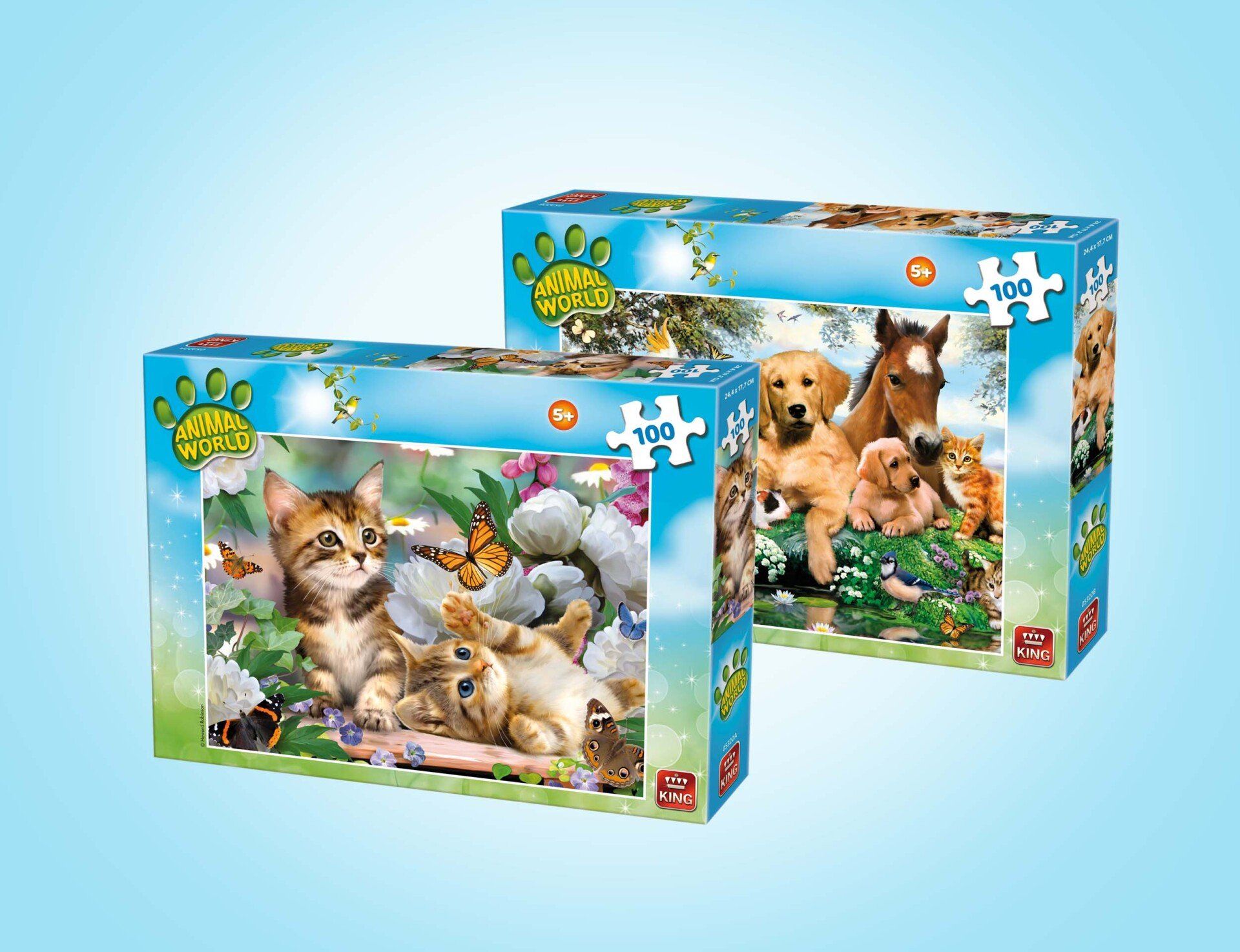 Twee puzzeldozen van 500 stukjes met afbeeldingen van dieren, één met kittens tussen de bloemen en één met een hond en een paard.