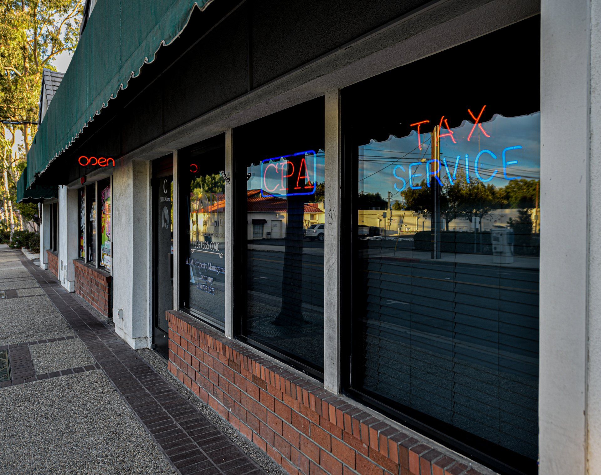 Wolf Certified Public Accountant building with a neon sign that says tax service