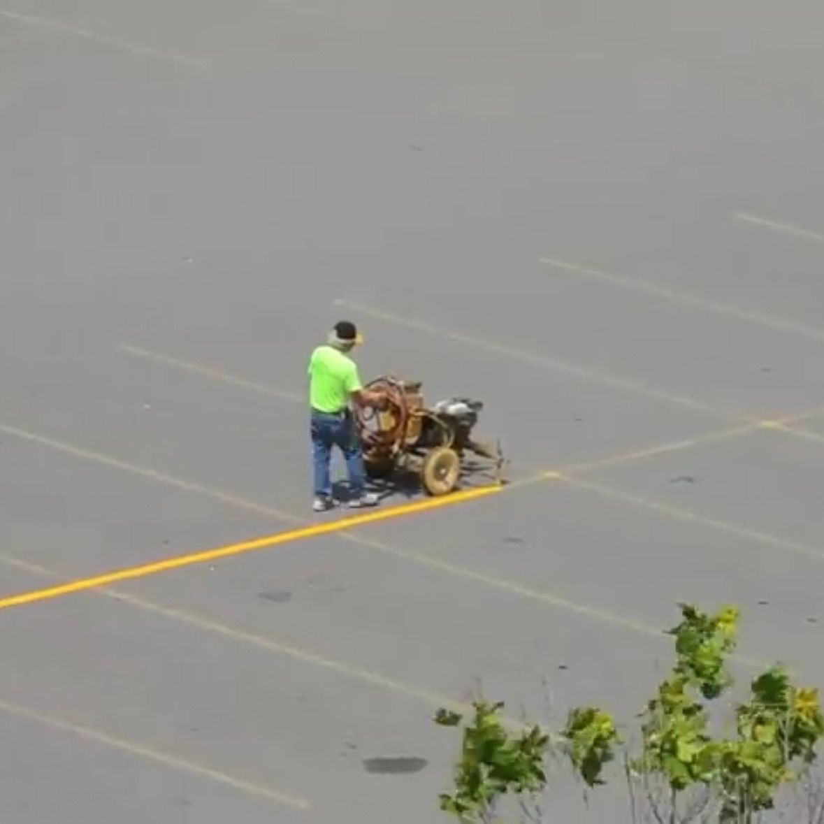 Restriping Parking Lot Lines, yellow oil based paint
