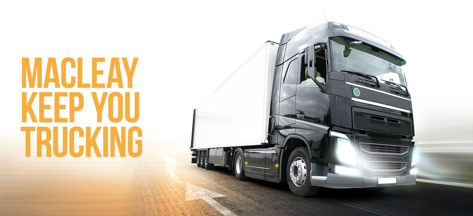 Macleay trucking ad with white semi-truck and orange text, “Keep you trucking”