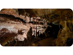 A large cave filled with lots of rocks and formations.