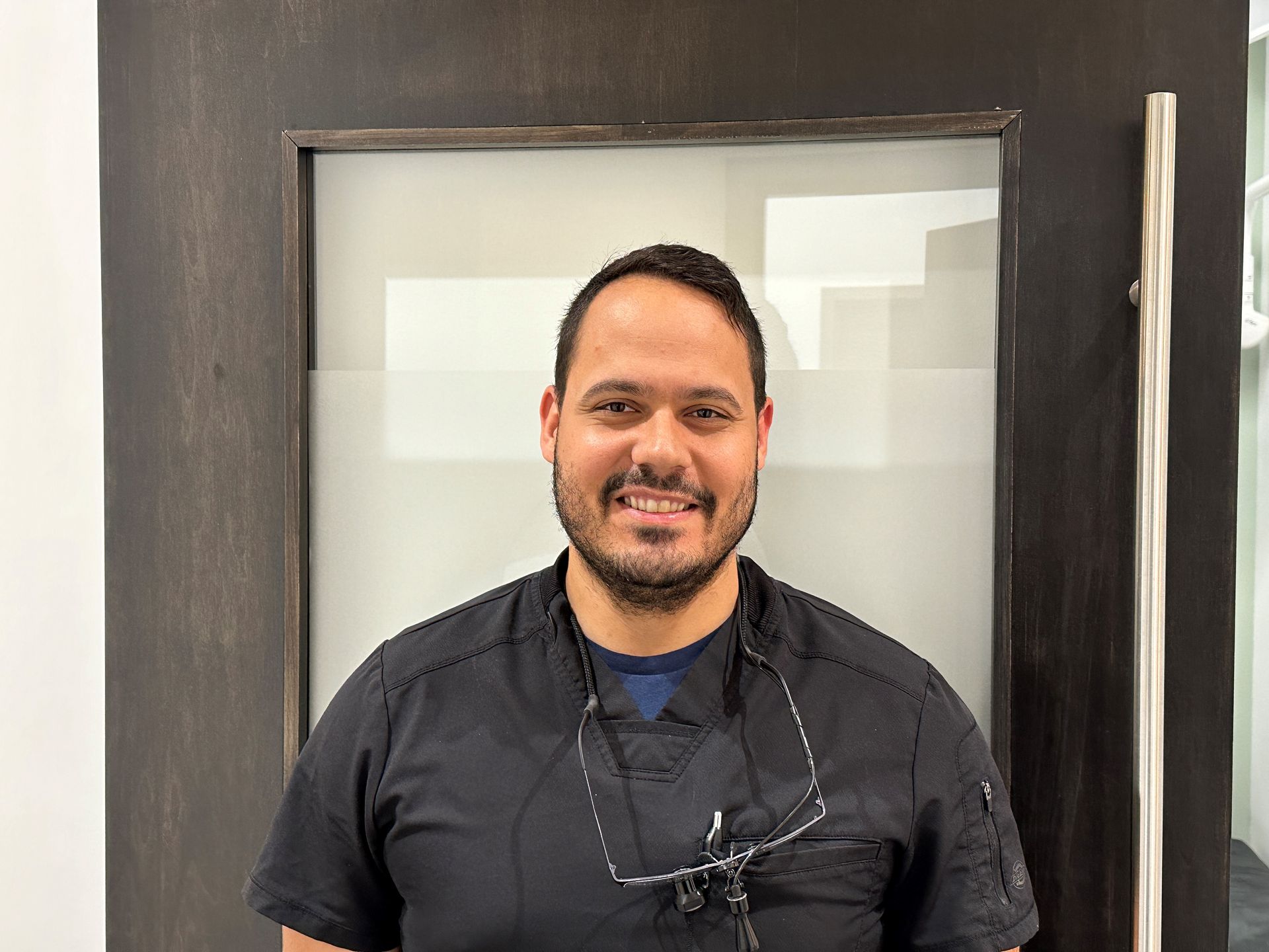 Visit us for teeth whitening and periodontal therapy in Topeka, KS. Nathan Smiling | Dental Clinic Staff by West Ridge Mall in Topeka, KS | Visit us for implants and teeth whitening.