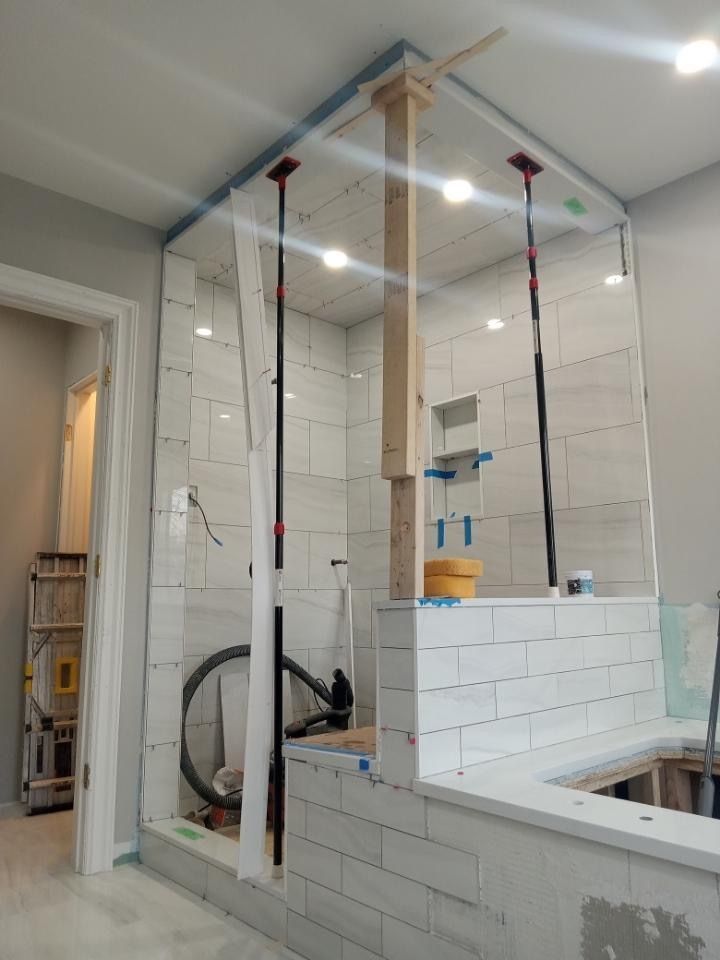 A bathroom is being remodeled and a shower is being built.